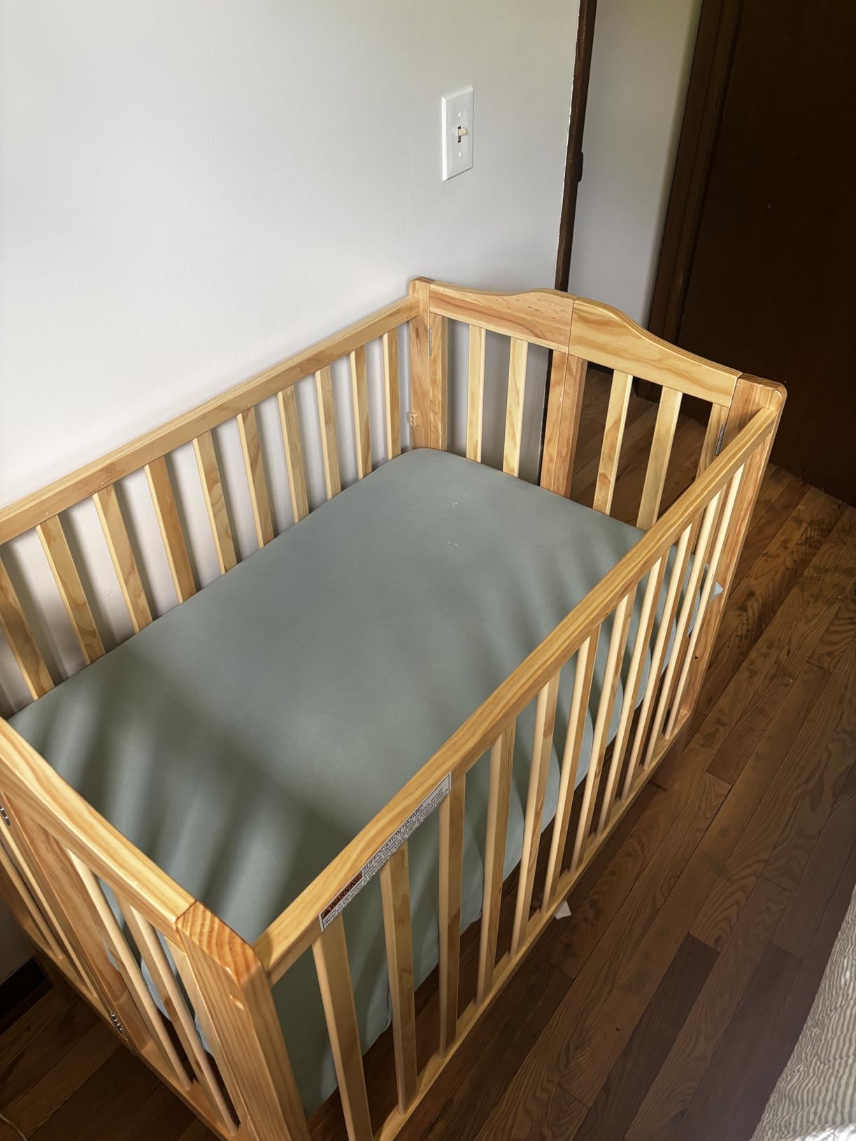 Delta Children Folding Portable Mini Baby Crib with 1.5-inch Mattress - Greenguard Gold Certified, White customer photo 1