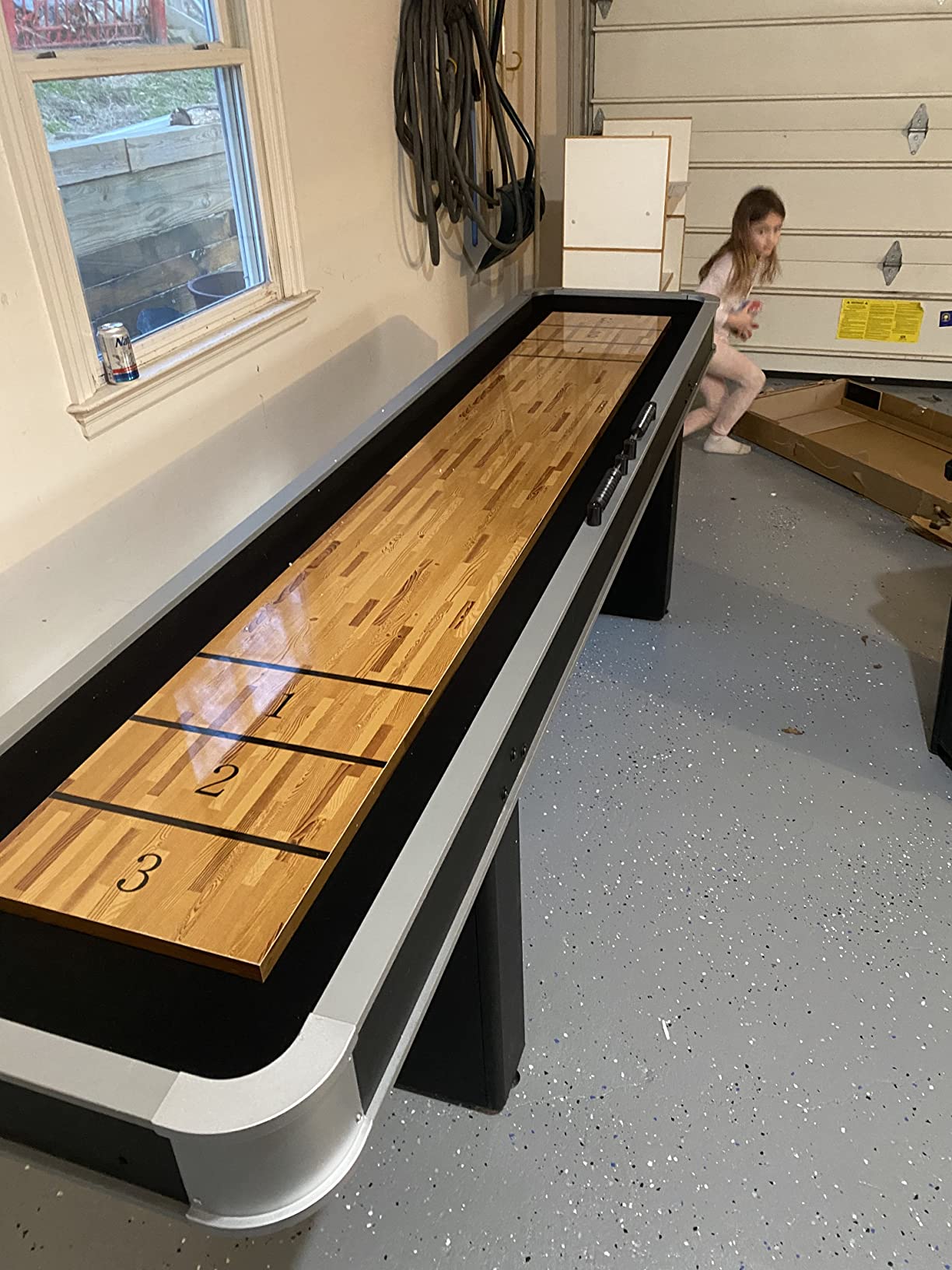 Atomic 9' LED Shuffleboard Tables with Poly-Coated Playing Surface for Smooth, Fast Puck Action and Pedestal Legs with Levelers for Optimum Stability and Level Play customer photo 1