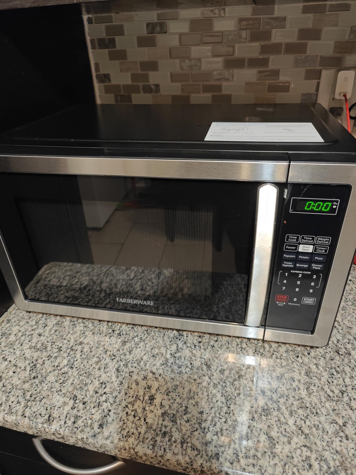 Farberware 1.1 Cu. Ft. Countertop Microwave Oven - 1000 Watts Power, Auto Cook Settings, Defrost, Easy Clean and Child Safety Lock - Stainless customer photo 1
