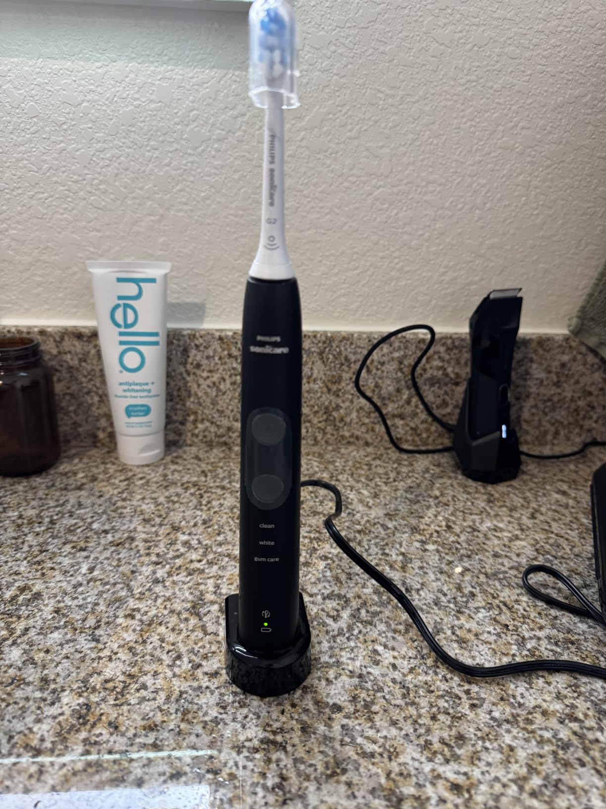 Philips Sonicare ProtectiveClean 5300 Rechargeable Electric Toothbrush, with Pressure Sensor, 3 Cleaning Modes, SmarTimer and QuadPacer, with 2 Bonus Brush Heads, Travel Case, Black, Model HX6423/34 customer photo 1
