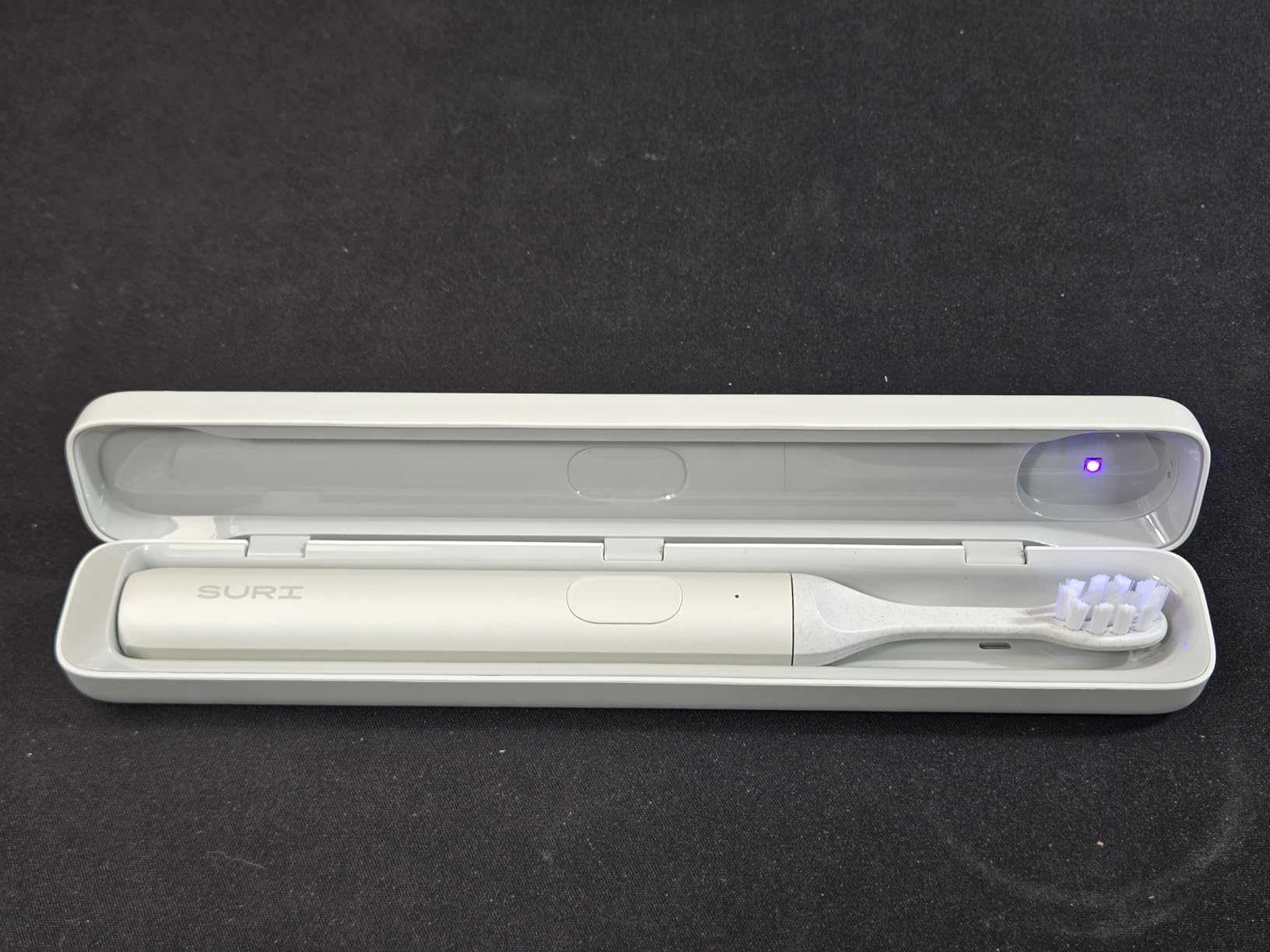 SURI Pro Sonic Electric Toothbrush | Pressure Sensor | Aluminium Body | 2-Minute Timer | Plant-Based Heads | Green customer photo 1