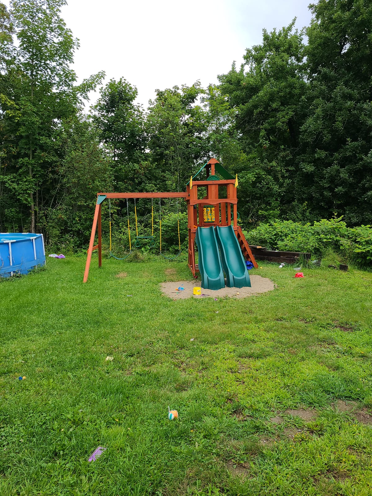 Gorilla Playsets Playmaker Deluxe Wooden Swing Set with Vinyl Canopy Roof, Dual Wave Slides, and Rock Climbing Wall, Redwood Stained Cedar customer photo 2