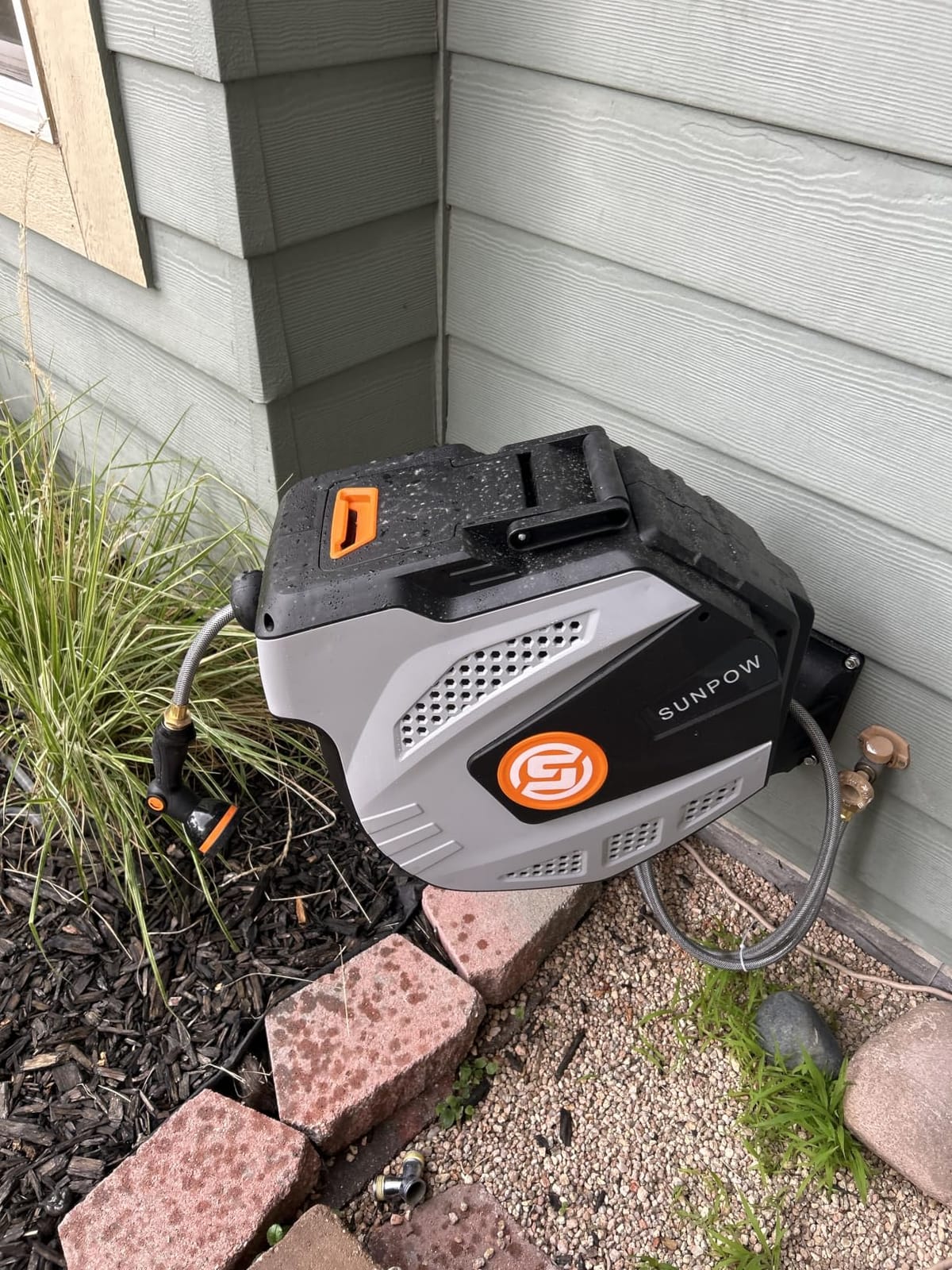 SUNPOW Retractable Garden Hose Reel - 1/2 inch x 50ft Heavy Duty Wall Mounted Hose Reel with 3/4 inch Brass Fitting & 10 Sprayer Nozzle - Any Length Lock, Auto Rewind System, 180°Swivel Bracket- Grey customer photo 1